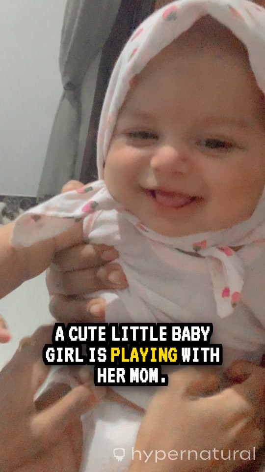 Sweet Moments: Baby Girl's Joyful Playtime with Mom and Dad