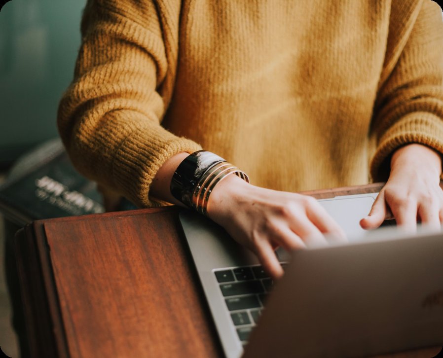 Woman typing at laptop