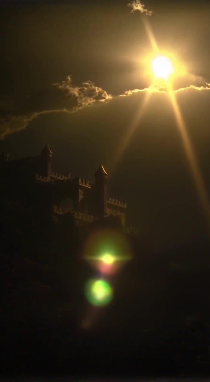 A single beam of light slowly illuminates the surrounding darkness, creating a serene atmosphere in the night sky.
