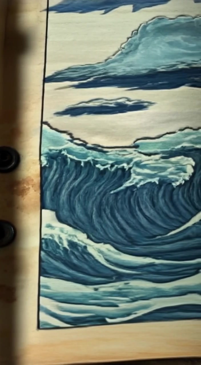 A detailed view of a hand-drawn stormy sea on a page of the ancient book, with waves and dark clouds.