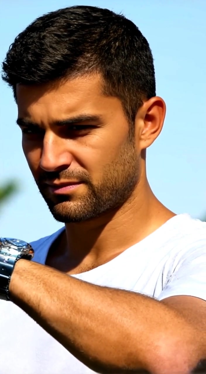 The man glances at his watch, anticipation growing in his eyes as he scans the bustling street.