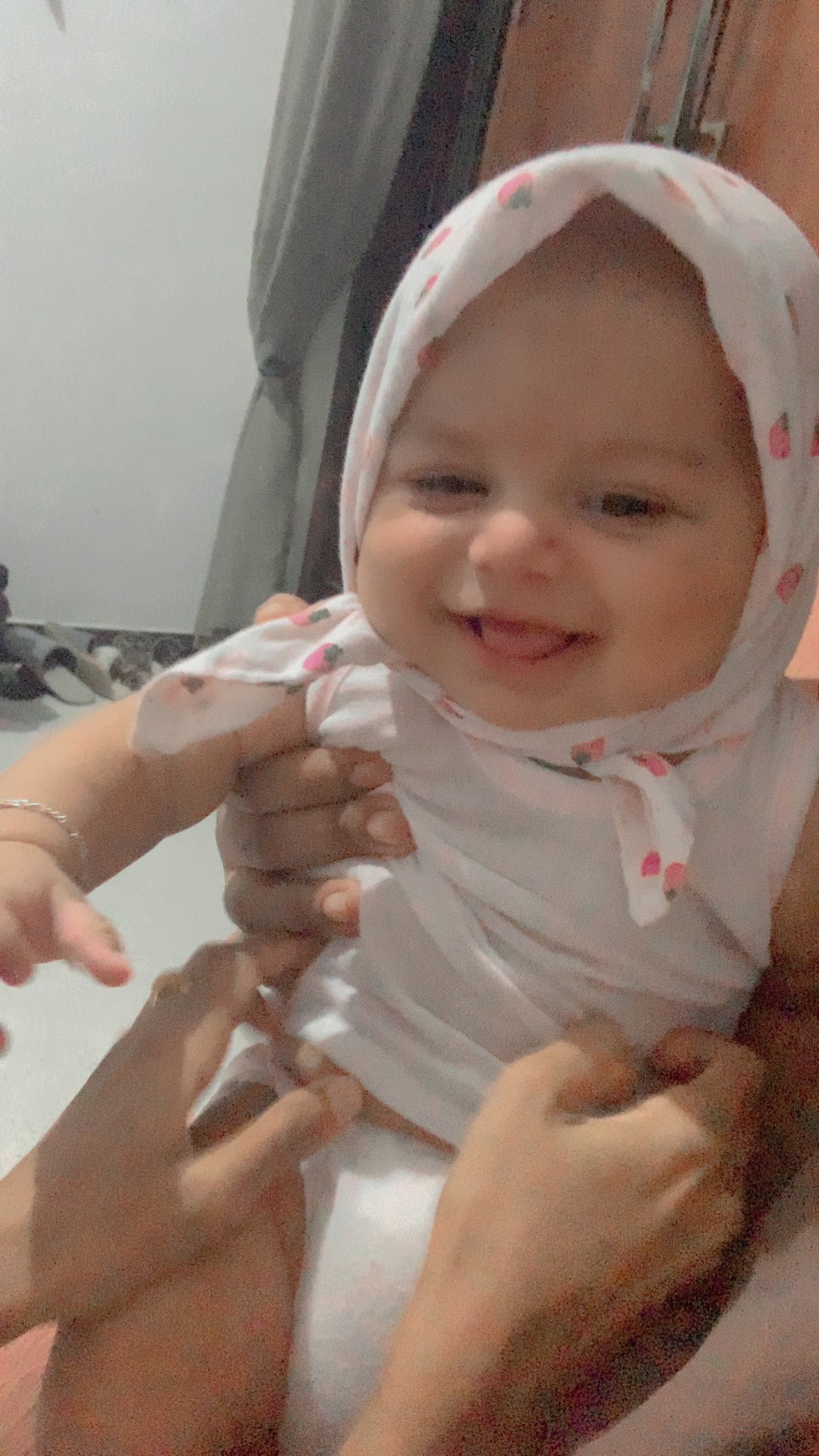 Sweet Moments: Baby Girl's Joyful Playtime with Mom and Dad
