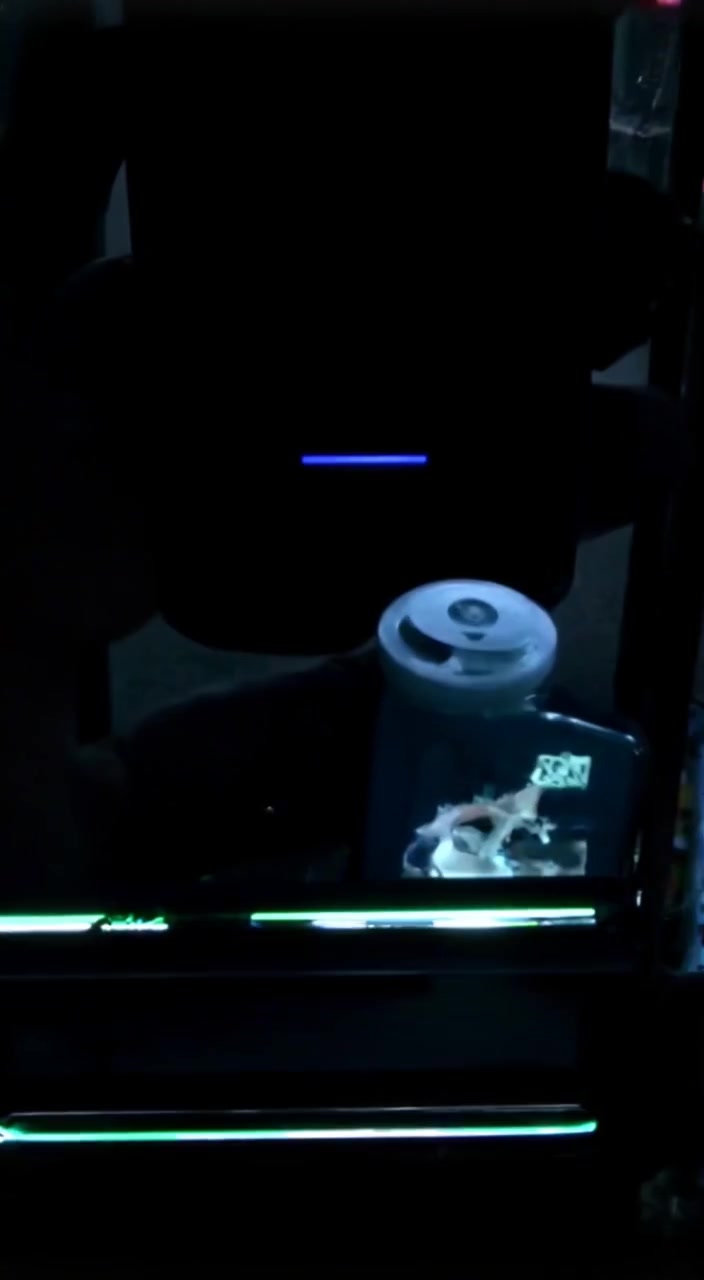 The phone screen flickers softly, highlighting the message 'Don’t open' in the dimly lit room.