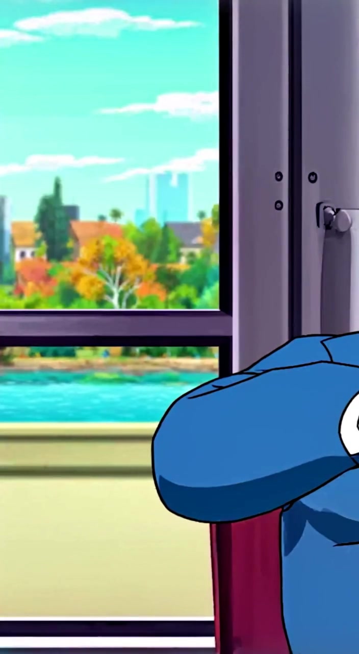 The man leans back, a playful smile appearing as he gazes thoughtfully out the window.
