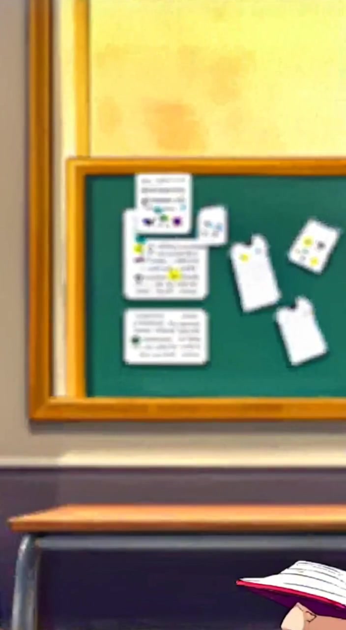 The boy flips through a notebook, focused, as sunlight filters gently through the classroom window.