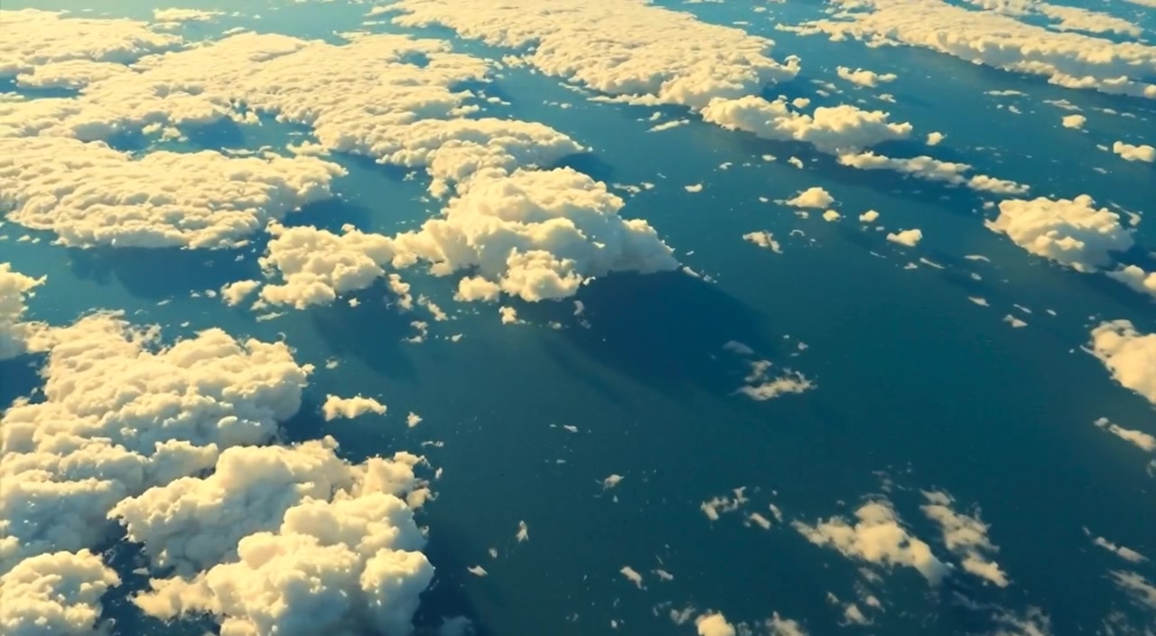Swirling clouds gently drift in the clear blue sky, revealing the vastness of the serene stratosphere.