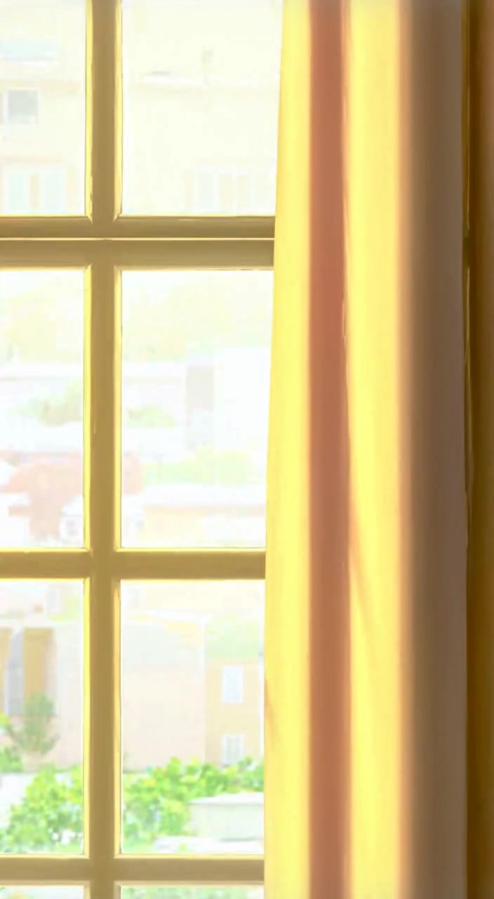 A gentle breeze sways the curtains as soft morning light fills the bedroom, casting warm shadows on the walls.