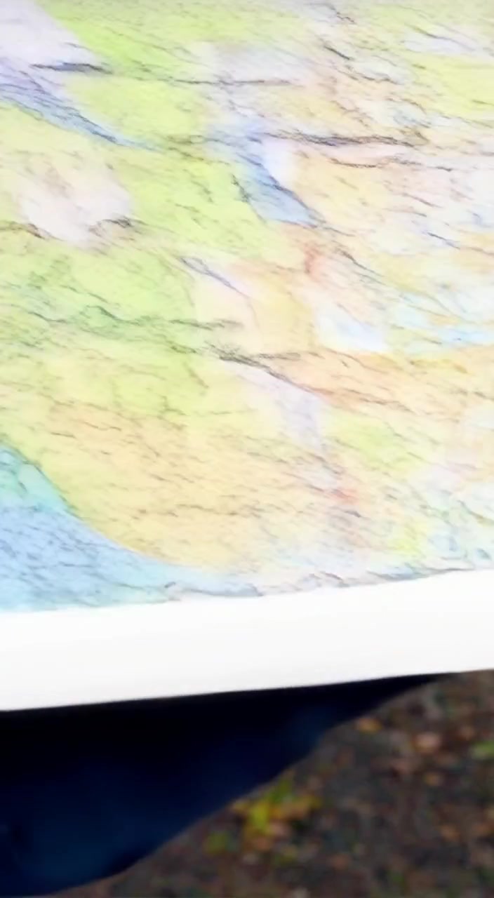 A hiker gently unrolls a map, while a gentle breeze rustles the leaves around an open backpack.
