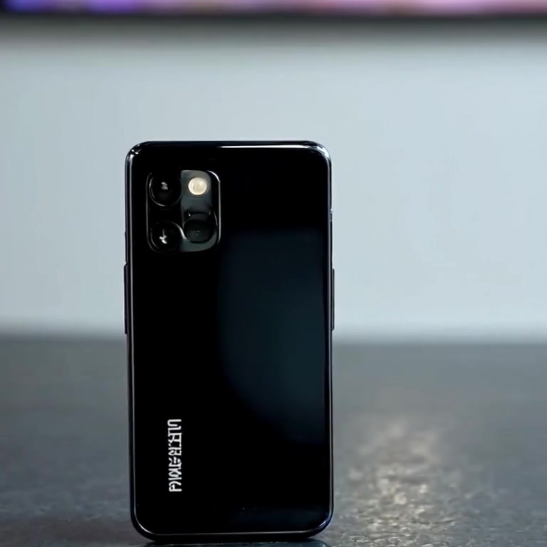 The smartphone gently reflects ambient light while the camera slowly pans around it, showcasing its elegant design.