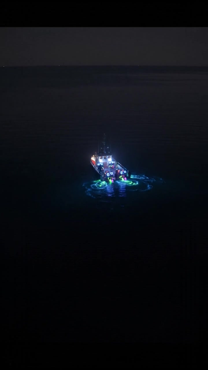 A boat on the calm surface of the North Sea, with diving gear laid out for divers, ready for exploration.
